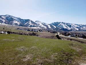 Property view of mountains with a rural view