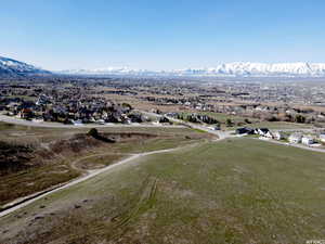 Birds eye view of property with a mountain view