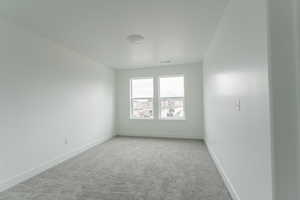 View of carpeted spare room