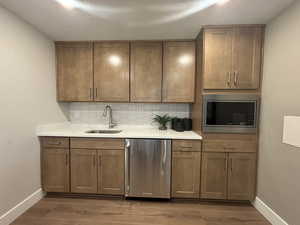 basement kitchenette  - image is of furnished model home - actual finishes may differ - furnishings not included