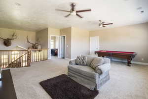 Rec room with billiards, ceiling fan, and carpet floors