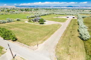 Birds eye view of property featuring a mountain view and a rural view