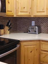 Detailed back splash and exceptionally well maintained with upgraded cabinets