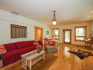 Basement living room with windows and walk-out entrance