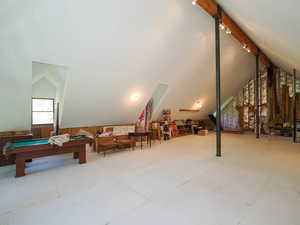 The steel columns reach approx 17 feet to the exposed ridge beam.  Attic also features 5 interior dormers providing ample natural light and fresh air