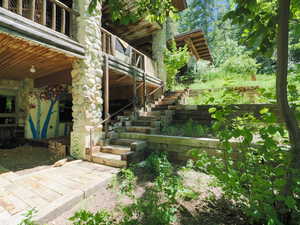 Private basement sitting area and staircase leading to carport