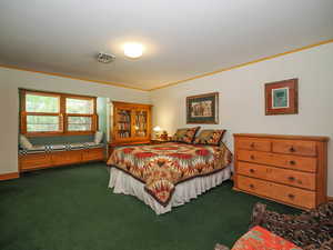 Bedroom 2 on the second story with built-in window seat with Southern mountain views