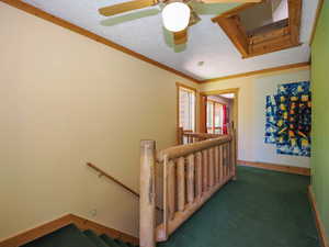 Bedroom floor hallway leading to bedroom 4, with log handrail