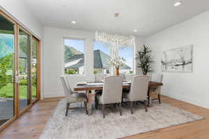 Dining room featuring a beautiful chandelier and sliding door to a covered deck.