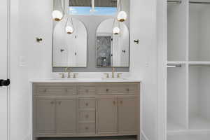 Bathroom with heated floor, bidet, dual sinks and oversized vanity