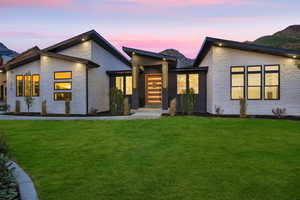 Modern home featuring a lawn