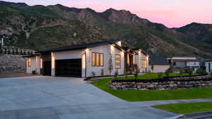 View of front of house featuring a garage and a mountain view