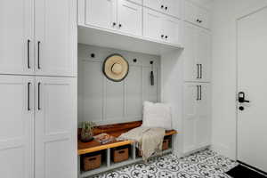 Mudroom with light tile flooring