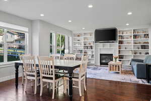 Open dining space and family room with wood-type flooring