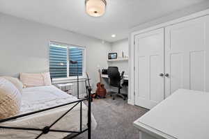 Bedroom with a closet and carpet