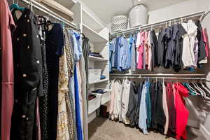 Walk in closet with carpet