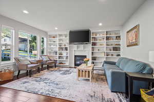 Family room with wood-type flooring