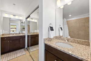 Bathroom with vanity and tile floors