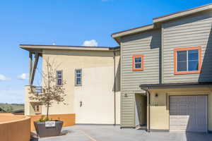 Rear view of house with a garage