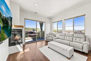 Living room with dark wood-type flooring