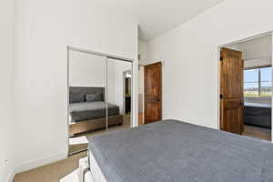 Bedroom with a closet and carpet flooring