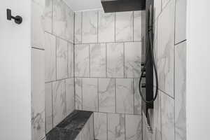 Bathroom with tiled shower