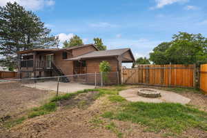 Exterior space featuring a deck and a fire pit