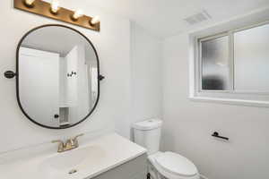 Bathroom featuring toilet and vanity