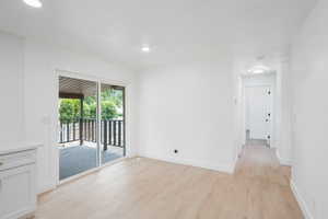 Unfurnished room featuring light wood-type flooring