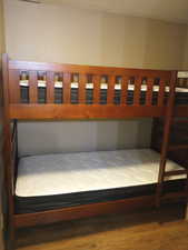 Bedroom with wood-type flooring