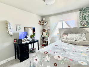 Bedroom featuring carpet flooring