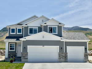 Craftsman house featuring a garage and a mountain view