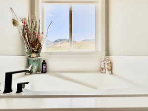 Bathroom featuring a bath to relax in