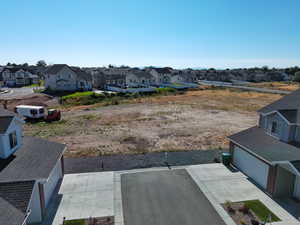 Drone / aerial view of side yard where a park will soon be built.