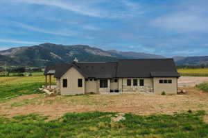 Rear view of house with a mountain view