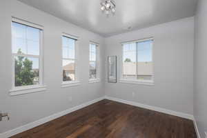 Empty room featuring hardwood / wood-style flooring