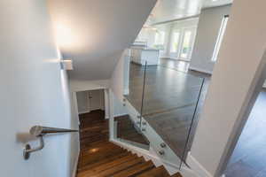 Stairs with hardwood / wood-style flooring