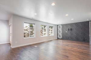 Interior space featuring dark hardwood / wood-style floors