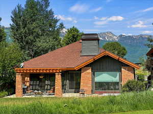 Exterior space featuring a mountain view and a patio area