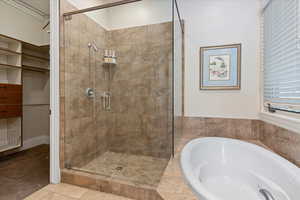 Bathroom with tile floors and separate shower and tub