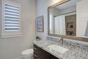 Bathroom with toilet and vanity