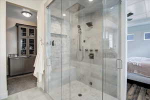 Bathroom with tile floors and an enclosed shower