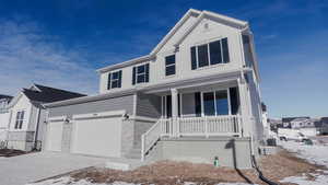 View of front of home with central air condition unit and a porch