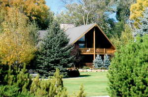 Exterior space featuring a wooden deck and a yard