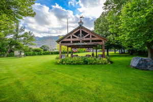 View of yard with a mountain view and a gazebo