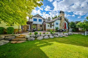 Exterior space featuring a patio, a front yard, and a pergola