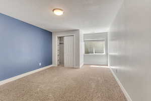 Bedroom featuring a walk-in closet.