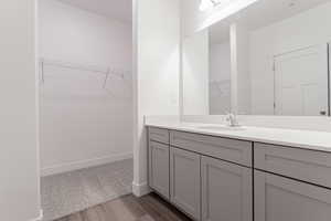 Bathroom featuring hardwood / wood-style floors and vanity