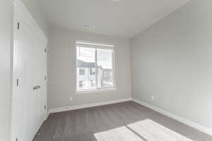 Unfurnished bedroom featuring carpet flooring