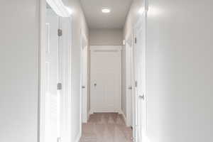 Hallway with light carpet